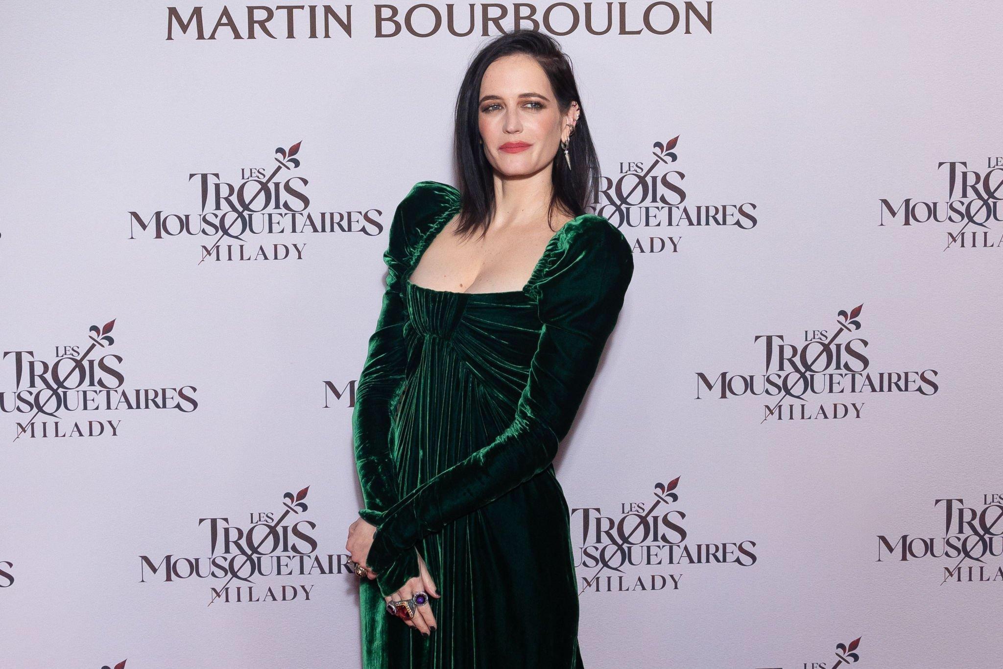 Eva Green in a stunning emerald green gown at the 300: Rise of an Empire premiere, a perfect example of a bold red carpet color.